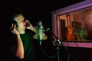 Recording narration at Auckland studio