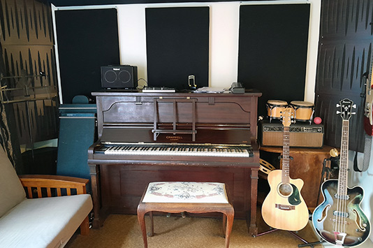 piano and guitars in recording studio